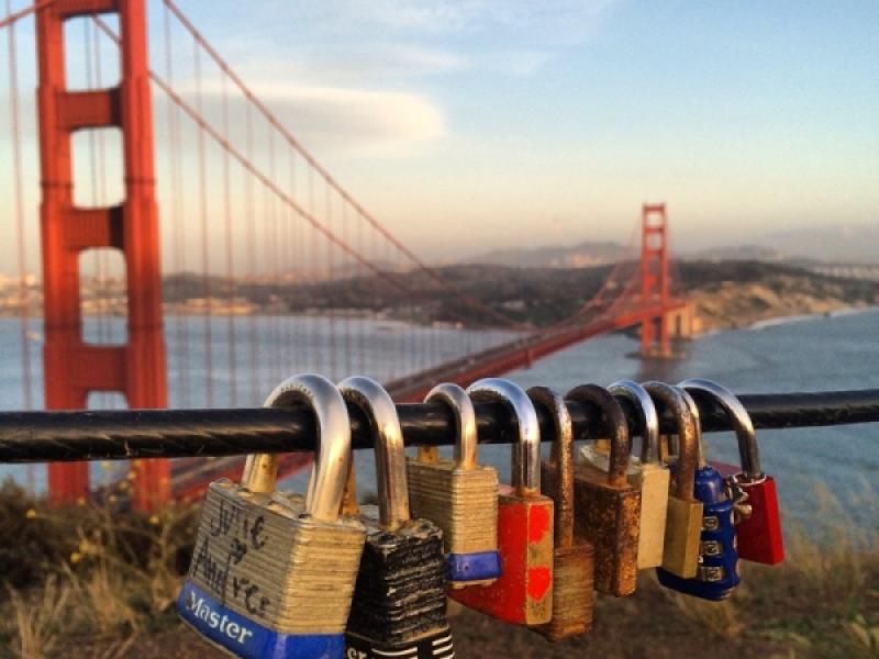 Love locks passing by with a hug and a kiss to San Francisco Bay