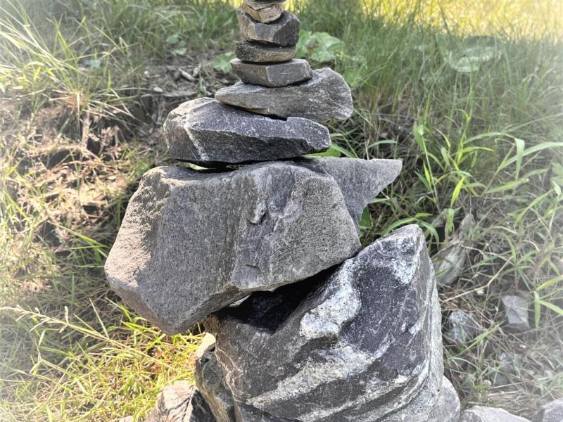 stones stacked by size on grass