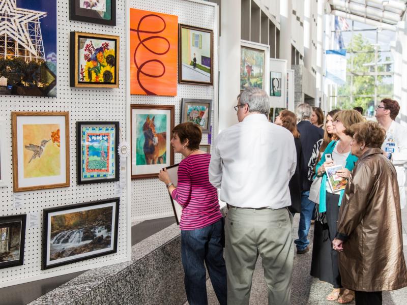 3rd Annual Exhibit Attendees viewing the artwork on display at Carilion Clinic during their awards reception.