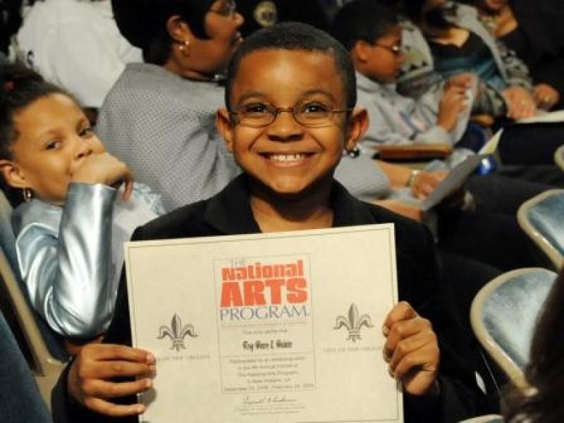 4th Annual Exhibit Participant, Troy Pierre II Holding Certificate of Participation