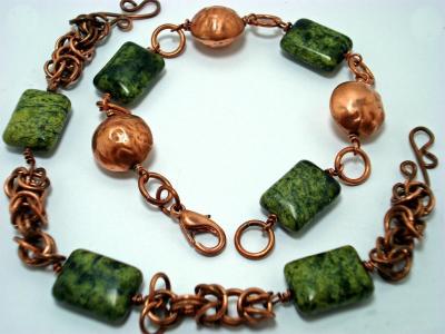 2 bracelets - repousee beads and chryospace gem beads