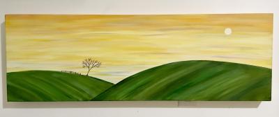 golden sky with moon. Rolling green hills with one tree