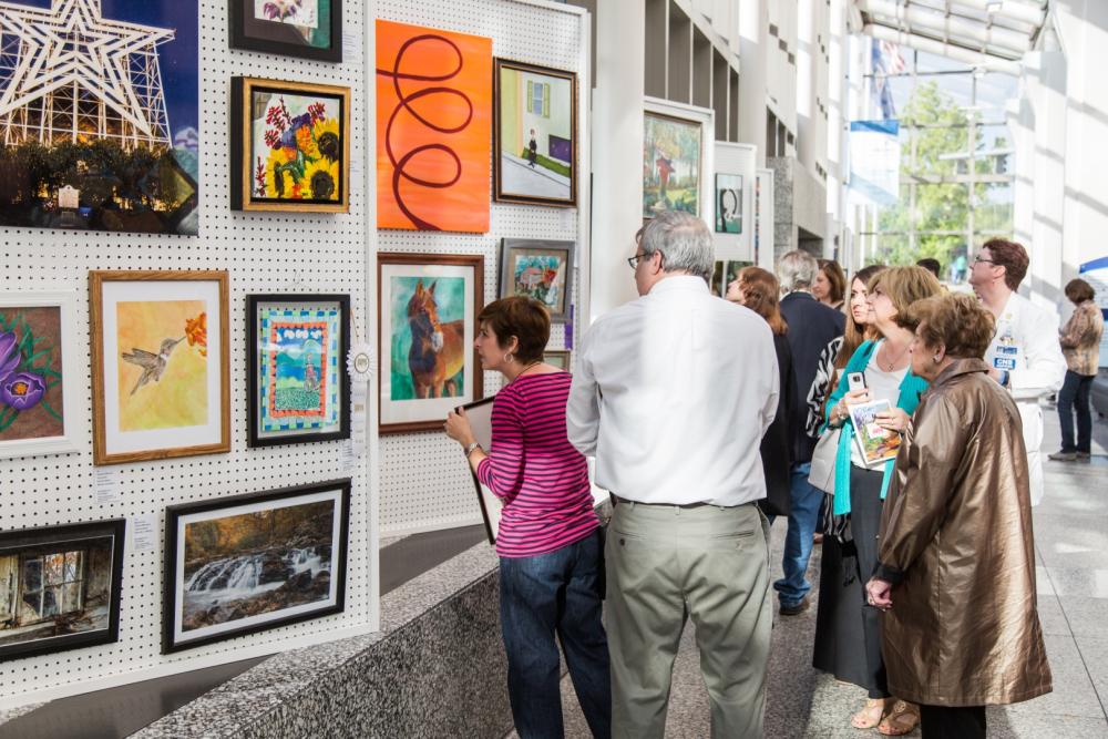 3rd Annual Exhibit Attendees viewing the artwork on display at Carilion Clinic during their awards reception.