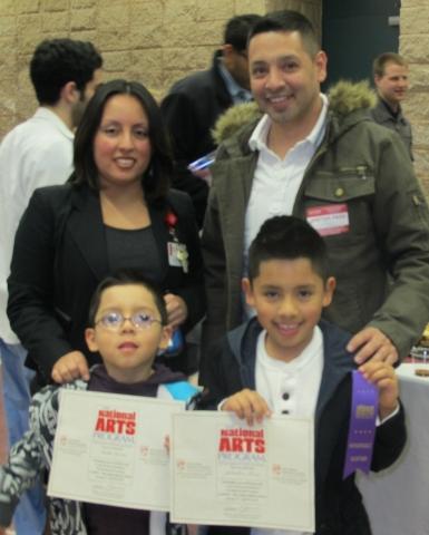 1st Annual Exhibit Sebastian Luna Pictured with His Family.