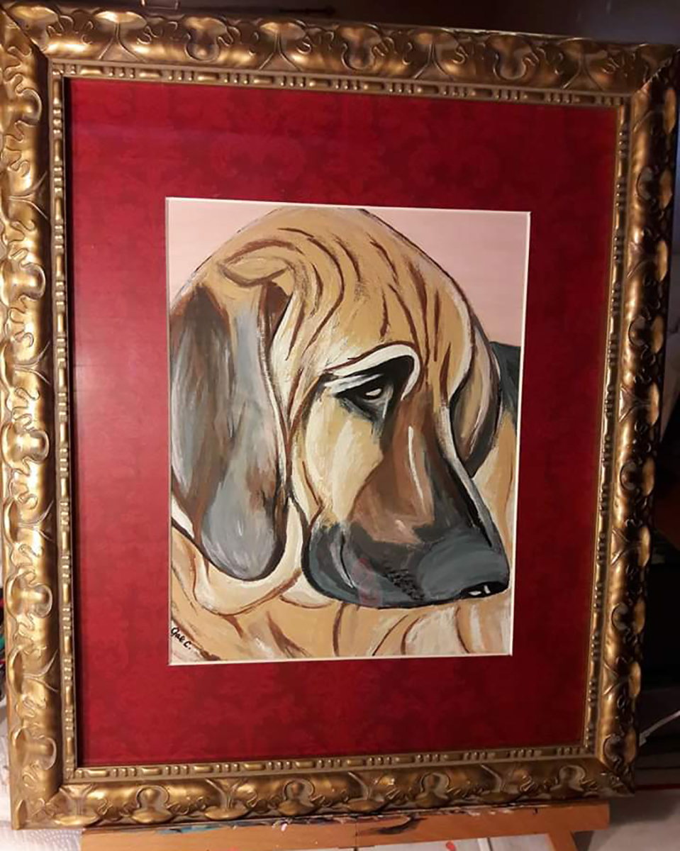 Canvas portrait of large hound dog with red matte and gold frame.