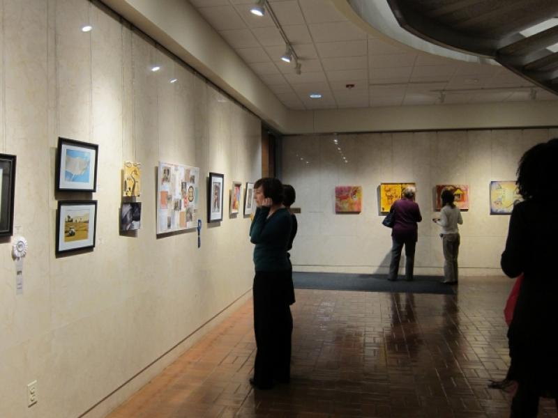 10th Annual Exhibit Attendees taking in the artwork at the Block Gallery in the Raleigh Municipal Building 