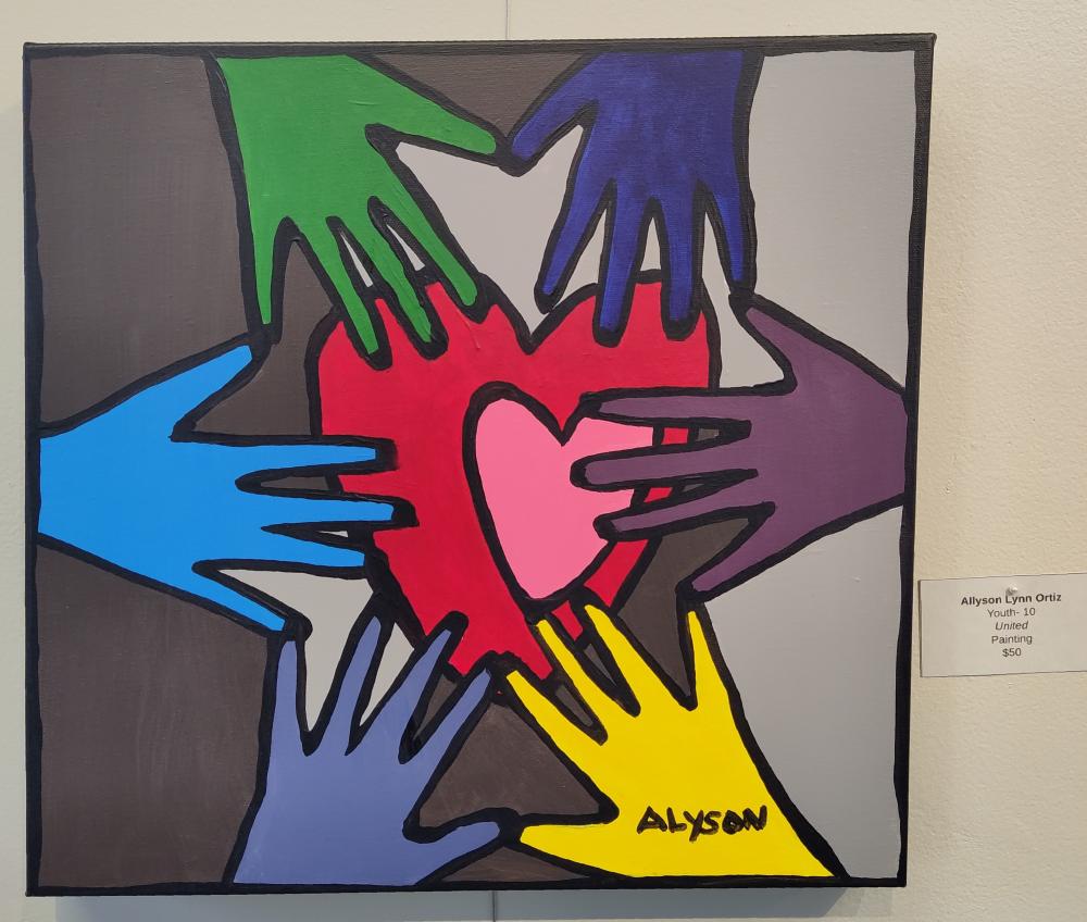 Painting of Multicolored hands touching a heart at the center of the canvas