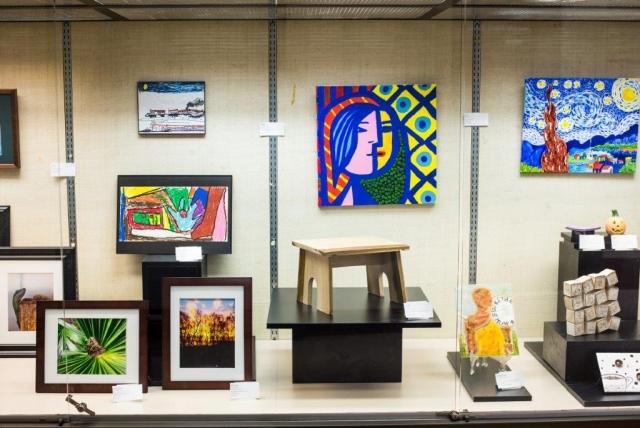 5th Annual Exhibit One of the beautiful glass cases featuring some of the colorful artwork from this year's show.