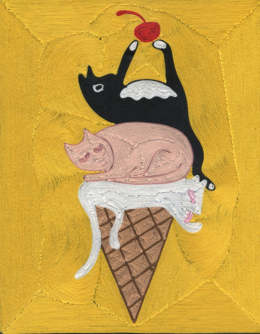 Three cats on top of an ice cream cone, as if scoops of ice cream